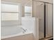 This bright bathroom boasts a separate shower, soaking tub and ample natural light at 899 Addison Ne Dr, St Petersburg, FL 33716