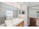 The bright bathroom features dual sinks, tile floors and granite countertops at 899 Addison Ne Dr, St Petersburg, FL 33716