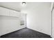 Bright bedroom featuring mounted cabinets and neutral carpeting at 899 Addison Ne Dr, St Petersburg, FL 33716