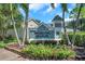 Sterling Manor community entrance sign surrounded by flowers and palm trees, creating a welcoming ambiance at 899 Addison Ne Dr, St Petersburg, FL 33716