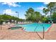 Community pool and spa with brick surround and lounge chairs on a sunny day at 899 Addison Ne Dr, St Petersburg, FL 33716