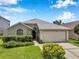 Charming single-story home with a well-manicured lawn and attached two-car garage at 899 Addison Ne Dr, St Petersburg, FL 33716