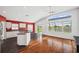 Bright living room featuring an open floor plan, a vaulted ceiling, and scenic lake views at 899 Addison Ne Dr, St Petersburg, FL 33716