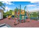 Colorful community playground with slide and climbing structure at 899 Addison Ne Dr, St Petersburg, FL 33716