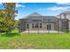 Relaxing screened-in patio offers privacy and protection with a great view of the backyard at 899 Addison Ne Dr, St Petersburg, FL 33716