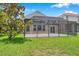 Spacious screened patio, perfect for outdoor relaxation and entertaining in a private backyard setting at 899 Addison Ne Dr, St Petersburg, FL 33716