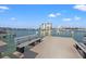 Scenic dock view with benches, clear water, and a marina, creating an idyllic waterfront setting at 9755 Harrell Ave # 101, Treasure Island, FL 33706