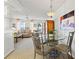 Inviting living area with water views and a dining space with a glass table, creating an elegant and comfortable atmosphere at 9755 Harrell Ave # 101, Treasure Island, FL 33706