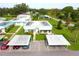 Aerial view of a residential community with well-kept lawns and assigned parking at 101 Cambridge Trl # 194, Sun City Center, FL 33573