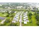 Mobile home community featuring cozy residences with private driveways and green spaces at 101 Cambridge Trl # 194, Sun City Center, FL 33573