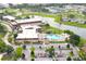 Beautiful community featuring a large community recreation center, resort pool, and tranquil lake at 101 Cambridge Trl # 194, Sun City Center, FL 33573