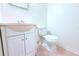Bathroom featuring a sink with cabinet, toilet, and tile flooring at 101 Cambridge Trl # 194, Sun City Center, FL 33573