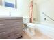 This bathroom features a modern vanity with storage, a comfort height toilet, and bright lighting at 101 Cambridge Trl # 194, Sun City Center, FL 33573