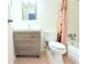 This bathroom features a modern vanity with storage, a comfort height toilet, and neutral tile at 101 Cambridge Trl # 194, Sun City Center, FL 33573
