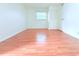 This bedroom features light walls and floors, bright natural light, and a closet for ample storage space at 101 Cambridge Trl # 194, Sun City Center, FL 33573