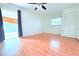 This bedroom features light walls and floors, bright natural light, and a sliding glass door for access to the porch at 101 Cambridge Trl # 194, Sun City Center, FL 33573