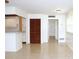Bright living area with tiled floors, white walls, and access to the kitchen area at 101 Cambridge Trl # 194, Sun City Center, FL 33573