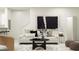 Stylishly furnished living room with modern art, comfortable seating, and natural light at 10203 Trumpet Honeysuckle Way, San Antonio, FL 33576