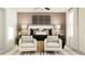 Serene bedroom with neutral tones, decorative wall art, and comfortable seating area at 10203 Trumpet Honeysuckle Way, San Antonio, FL 33576