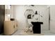 Modern office space featuring a black desk, hexagon mirror, contemporary decor, and ample natural light at 10203 Trumpet Honeysuckle Way, San Antonio, FL 33576