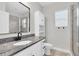 Bathroom showcasing granite counters, vanity with sink, mirror and walk in shower at 106 Cutlass Way, Oldsmar, FL 34677