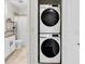 Stacked washer and dryer next to bathroom at 106 Cutlass Way, Oldsmar, FL 34677