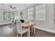 Open-concept living space with dark wood floors, seamlessly connecting the living area to the modern kitchen at 106 Cutlass Way, Oldsmar, FL 34677