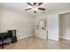 Bedroom featuring a ceiling fan, tile floor, a closet, and a dresser at 11029 Clay Pit Rd, Tampa, FL 33610