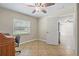 Bright bedroom with a ceiling fan, and a window that allows natural light to fill the space at 11029 Clay Pit Rd, Tampa, FL 33610