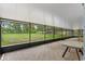 Spacious screened lanai with brick pavers, perfect for outdoor relaxation and entertaining overlooking a large lawn at 11029 Clay Pit Rd, Tampa, FL 33610