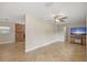 Inviting living room featuring a brick fireplace and neutral tile flooring at 11029 Clay Pit Rd, Tampa, FL 33610