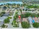 Beautiful aerial shot of home highlighting proximity to community amenities, lush landscaping, and nearby lake at 11415 Bright Star Ln, Riverview, FL 33569