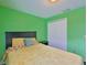 Bedroom boasts carpet flooring, a double bed, and a double-door closet for storage at 11415 Bright Star Ln, Riverview, FL 33569
