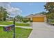 Inviting single-story home with a well-kept lawn and convenient mailbox by the sidewalk at 11415 Bright Star Ln, Riverview, FL 33569