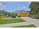 Charming single-story home featuring a well-manicured lawn and a two-car garage at 11415 Bright Star Ln, Riverview, FL 33569