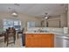 Bright kitchen features stainless sink, tile floor, and a cozy eat-in dining area at 11415 Bright Star Ln, Riverview, FL 33569