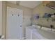 Functional laundry room with washer and dryer at 11415 Bright Star Ln, Riverview, FL 33569