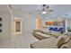 Expansive living area with tile floors, an open layout, and easy access to the kitchen at 11415 Bright Star Ln, Riverview, FL 33569