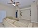 Open living room with ceiling fan, neutral walls and ceramic tile flooring at 11415 Bright Star Ln, Riverview, FL 33569