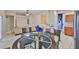 Open-concept living space featuring tile flooring and seamless flow to the kitchen at 11415 Bright Star Ln, Riverview, FL 33569