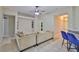 Spacious living room featuring neutral walls, ceiling fan, and tiled floors at 11415 Bright Star Ln, Riverview, FL 33569