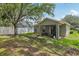 Cozy backyard boasts a covered patio, sliding glass doors, and ample space for outdoor enjoyment at 11708 Crest Creek Dr, Riverview, FL 33569