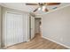 Bright bedroom with hardwood floors, double closets, and an ensuite bathroom at 11708 Crest Creek Dr, Riverview, FL 33569