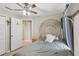 Comfortable bedroom with view into adjacent room and closet, decorated with cozy accents at 11708 Crest Creek Dr, Riverview, FL 33569