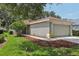 Charming one-story home with well-maintained lawn and landscaping, and an attached two-car garage at 11708 Crest Creek Dr, Riverview, FL 33569
