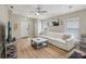Comfortable living room featuring a white sofa, a ceiling fan, and plenty of natural light at 11708 Crest Creek Dr, Riverview, FL 33569
