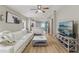 Open-concept living room with modern décor and hardwood floors, seamlessly flowing into the kitchen at 11708 Crest Creek Dr, Riverview, FL 33569