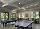 Entertaining game room with pool table, ping pong table, and foosball table for fun at 11901 Castine St, New Port Richey, FL 34654