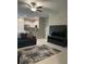 Open-concept living room that provides plenty of space for entertaining at 11901 Castine St, New Port Richey, FL 34654