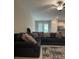 Comfortable living room with plenty of seating and access to the kitchen at 11901 Castine St, New Port Richey, FL 34654